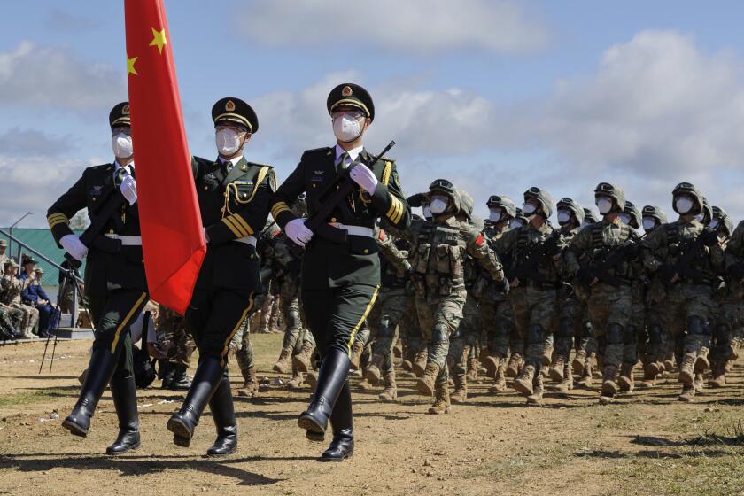In this handout photo released by Russian Defense Ministry Press Service, Chinese troops march during the Vostok 2022 military exercise at a firing range in Russia's Far East, Wednesday, Aug. 31, 2022. Russia on Thursday launched weeklong war games involving forces from China and other nations in a show of growing defense cooperation between Moscow and Beijing, as they both face tensions with the United States. (Vadim Savitsky/Russian Defense Ministry Press Service via AP)