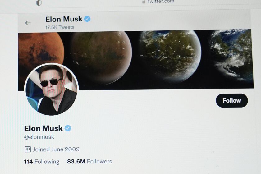 FILE - Part of the Twitter page of Elon Musk is seen on the screen of a computer in Sausalito, Calif., on Monday, April 25, 2022. The Tesla CEO gave the strongest hint yet Monday, May 16, 2022, that he would like to pay less for Twitter than his $44 billion offer made the previous month. (AP Photo/Eric Risberg, File)
