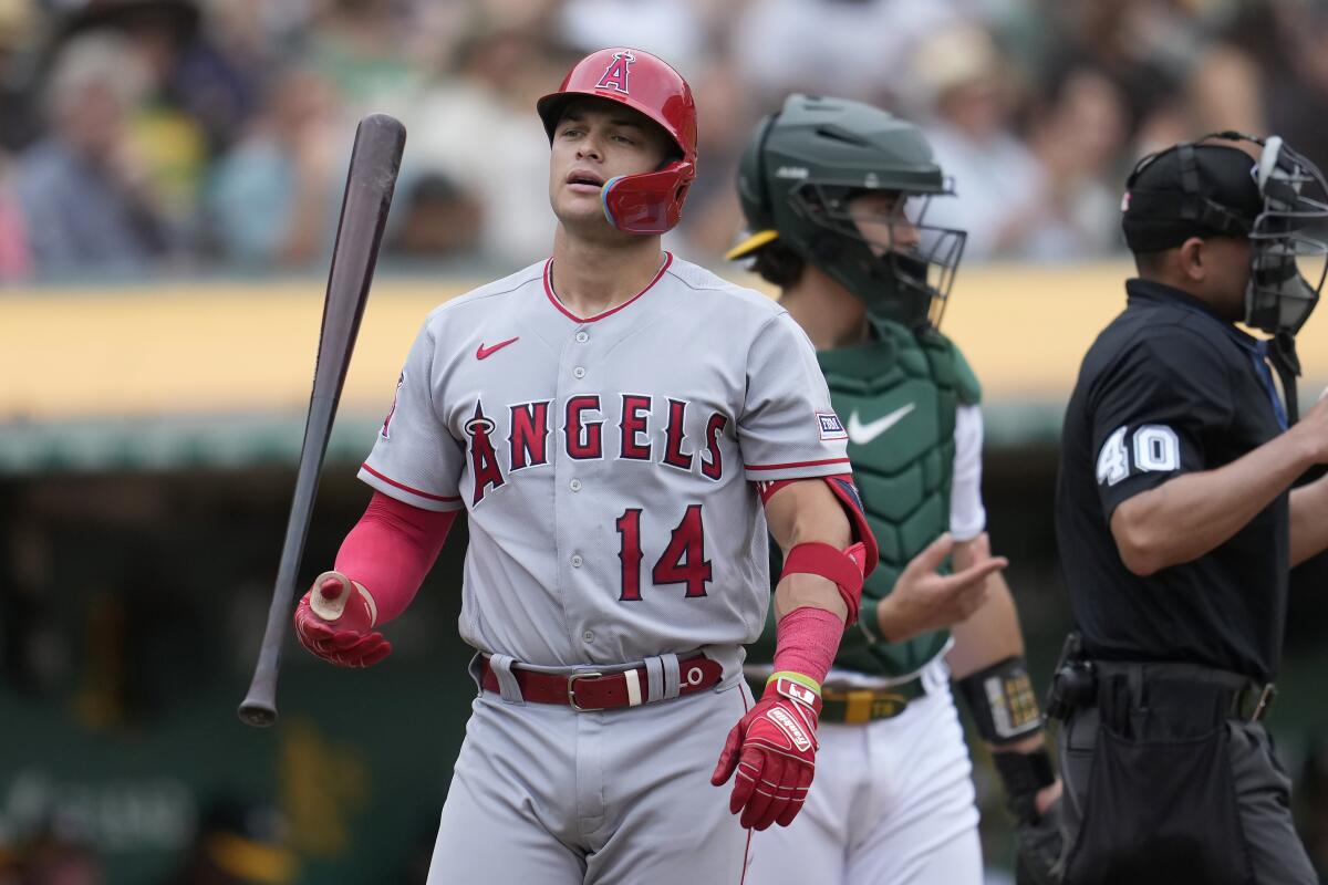 The Angels' Logan O'Hoppe walks to the dugout after striking out against the Oakland Athletics.