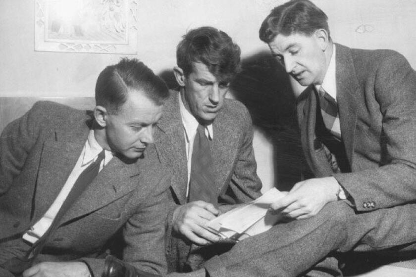 Dr. Charles Evans (left), Sir Edmund Hillary and George Lowe, members of the expedition that conquered Mt. Everest, look over plans to climb 24,000-foot Chim Ling.