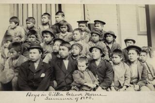 This photo made available by the Presbyterian Historical Society, Philadelphia shows students at a Presbyterian boarding school in Sitka, Alaska in the summer of 1883. U.S. Catholic and Protestant denominations operated more than 150 boarding schools between the 19th and 20th centuries. Native American and Alaskan Native children were regularly severed from their tribal families, customs, language and religion and brought to the schools in a push to assimilate and Christianize them. (Presbyterian Historical Society, Philadelphia via AP)