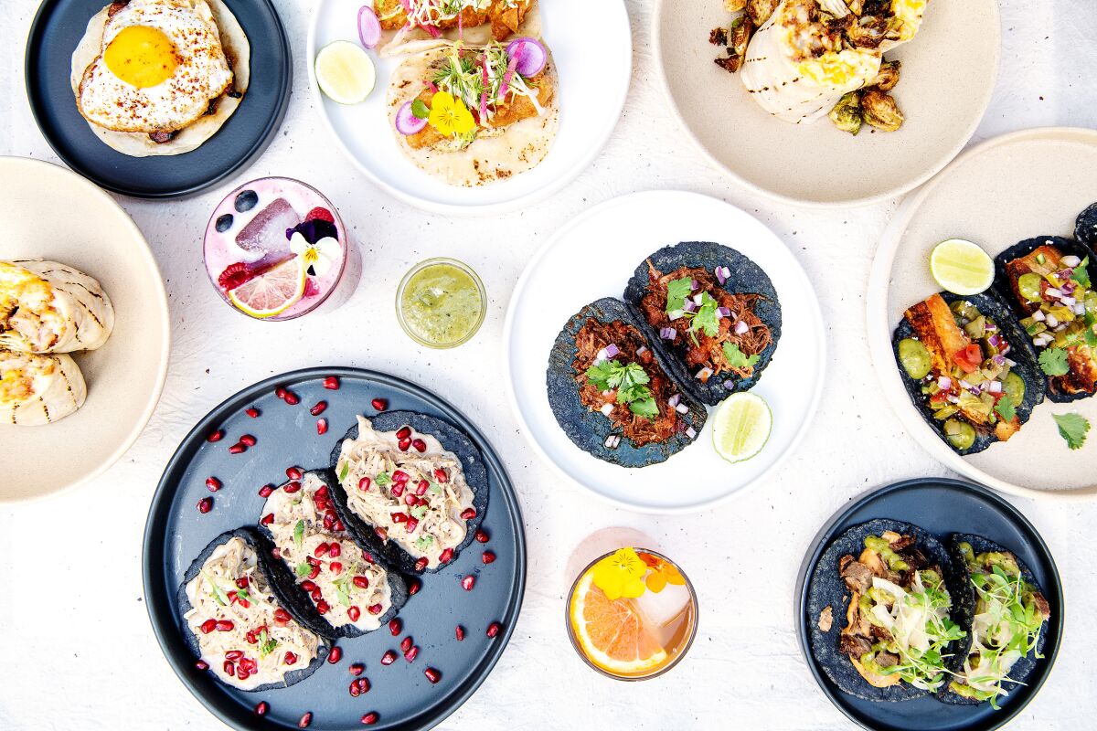 A spread of Macheen tacos and breakfast burritos.