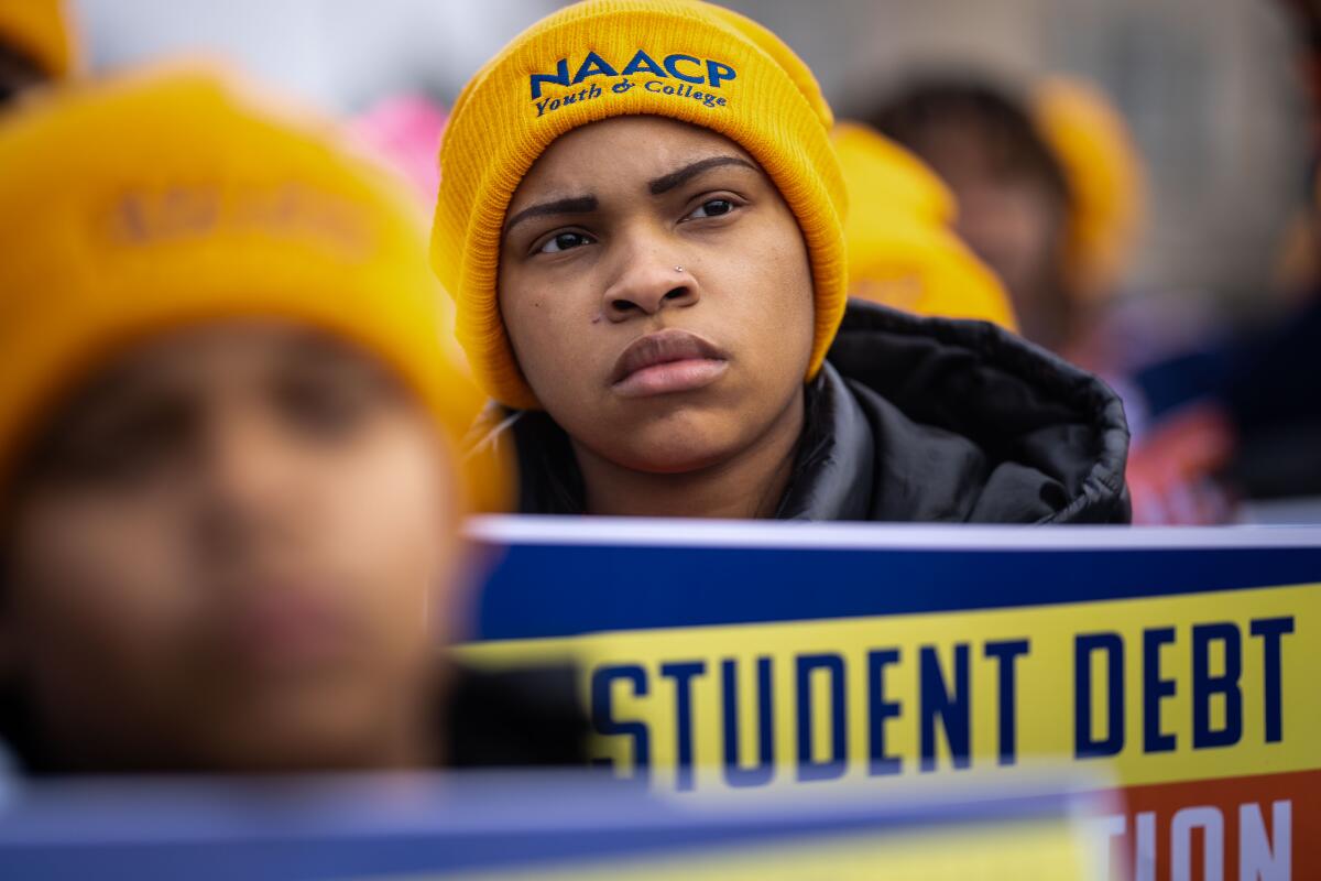 A person in a yellow NAACP knit hat at a Washington, D.C., rally