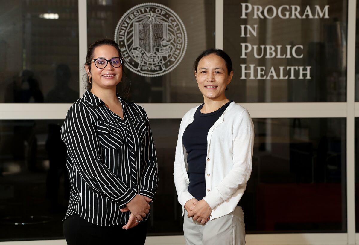 Public Health professors Jun Wu, left, and Alana LeBron.