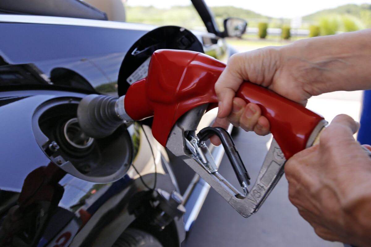 A consumer advocacy group contends that California refiners are holding down gasoline production to inflate pump prices