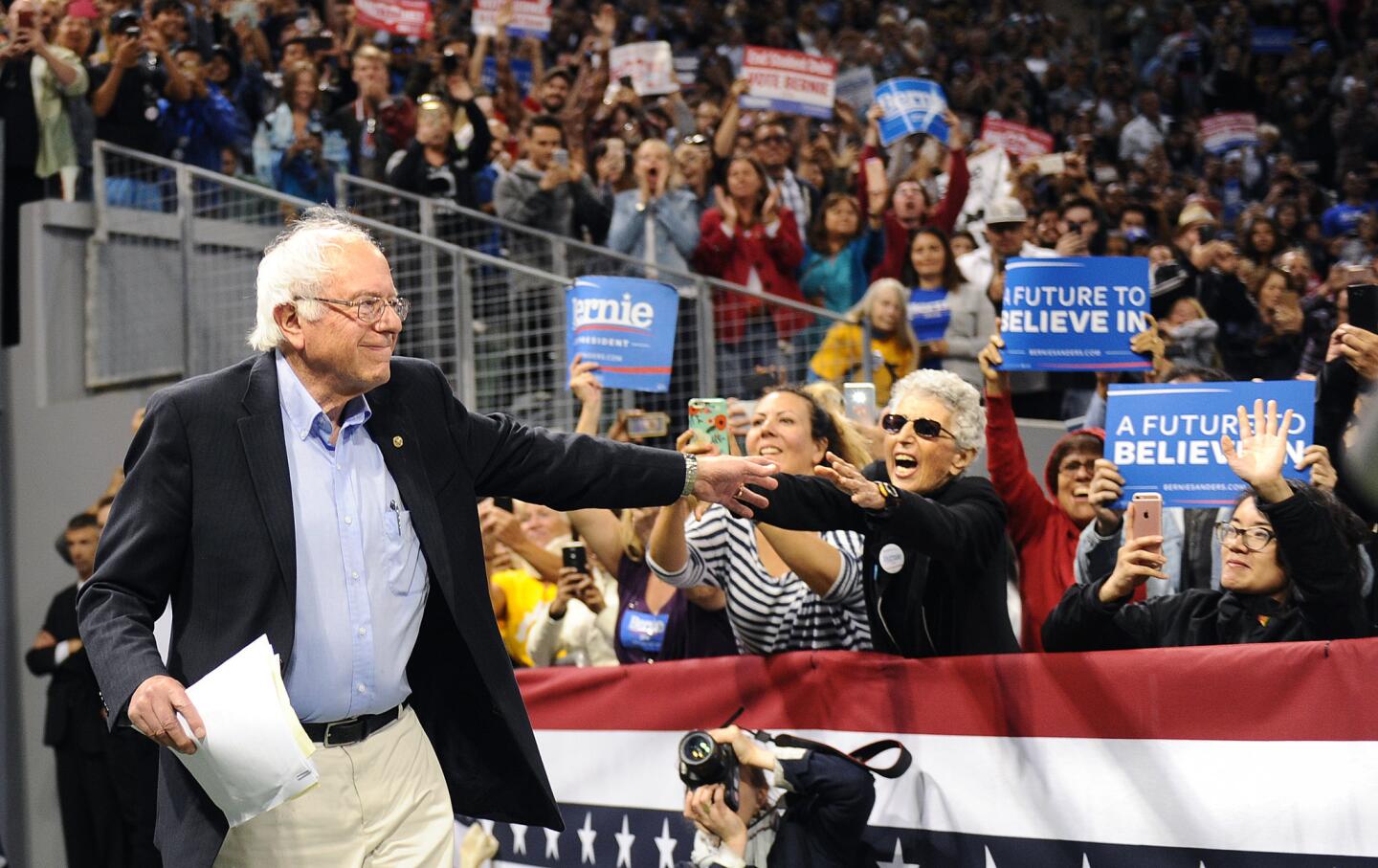 Democratic presidential candidate Bernie Sanders waves to supporters Tuesday night at StubHub Center in Carson, Calif.
