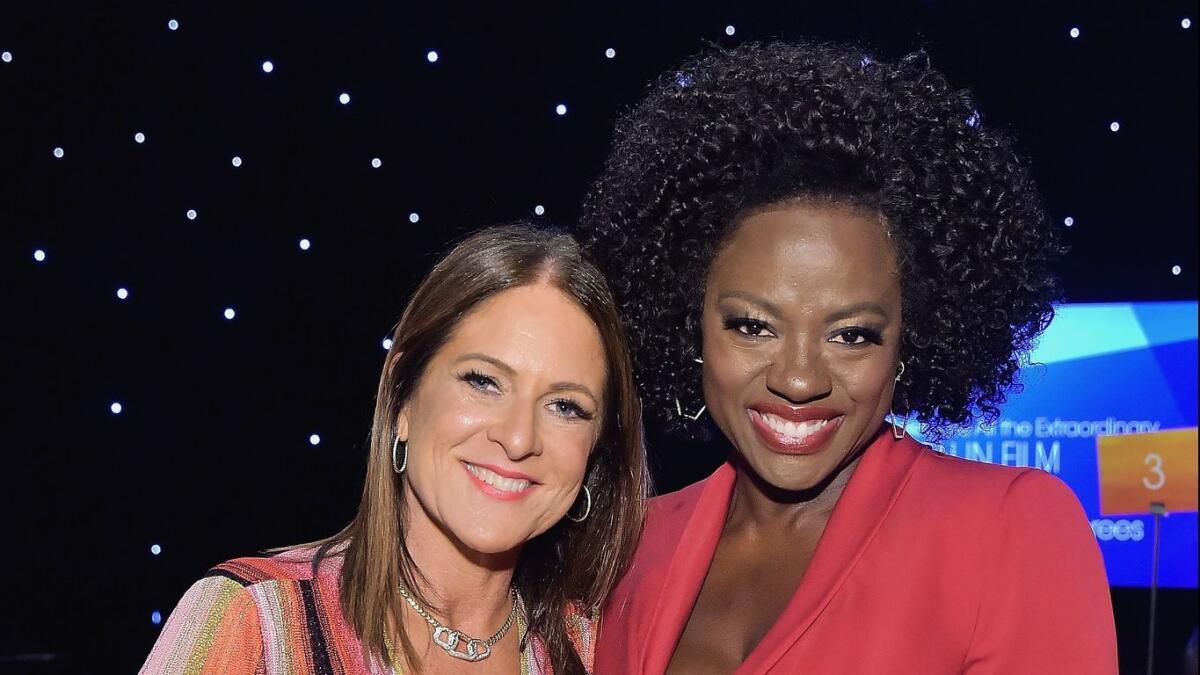 Cathy Schulman, left, accepted the Advocacy in Entertainment award from Viola Davis.