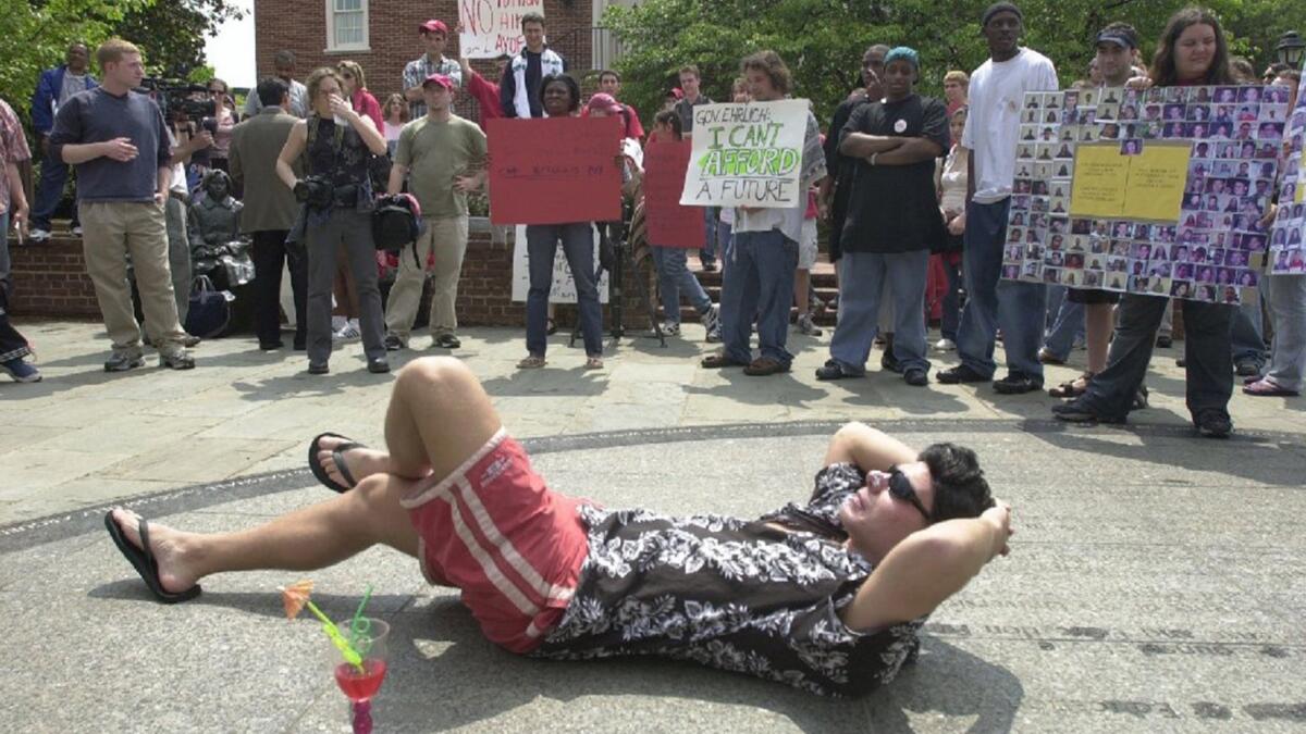 In May 2003, Eric Swalwell sunbathed as fellow University of Maryland students held signs protesting state budget cuts to higher education. The beach attire was in reference to Gov. Robert Ehrlich's island vacation.