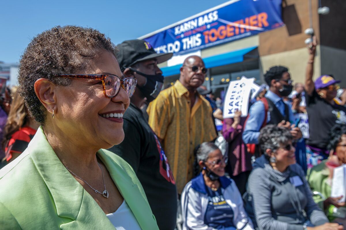 Rep. Karen Bass smiling with supporters