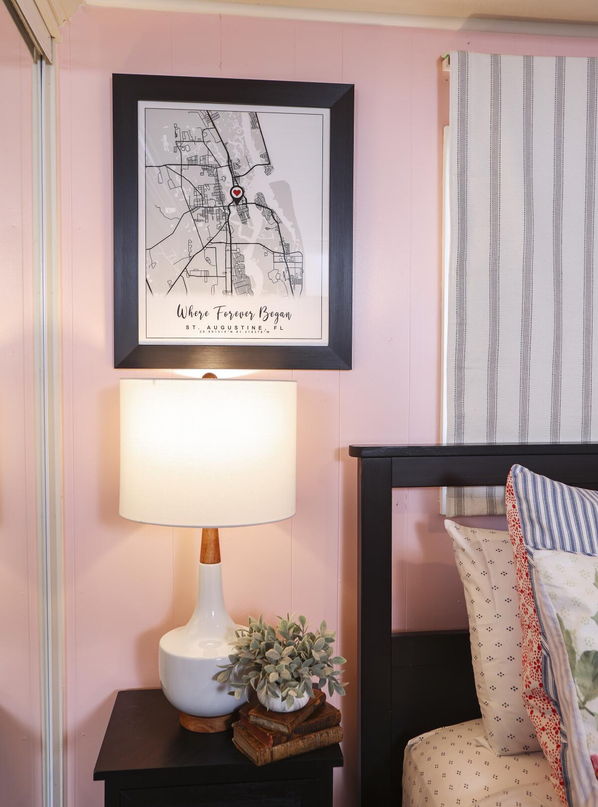 The framed map on the wall in the bedroom pinpoints where the couple met in St. Augustine, Fla.