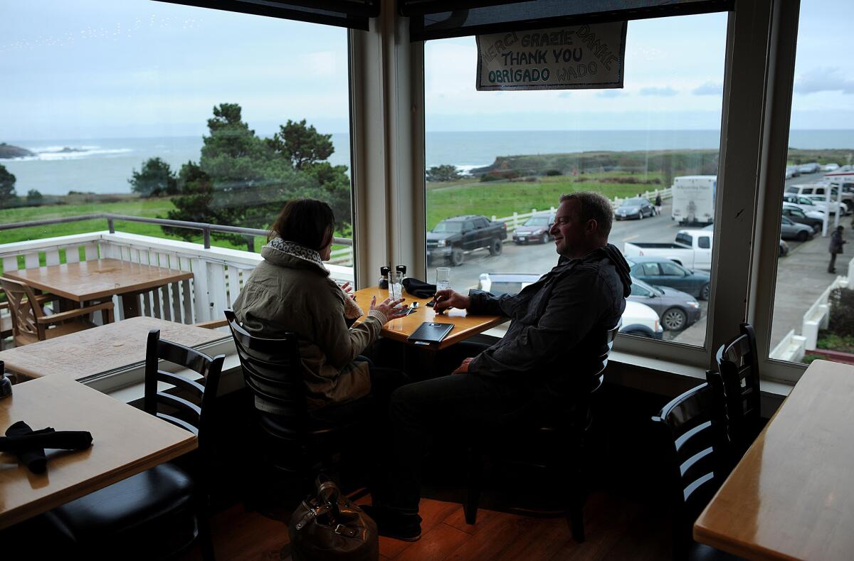 Customers enjoy the view at Flow restaurant on Main Street in Mendocino.