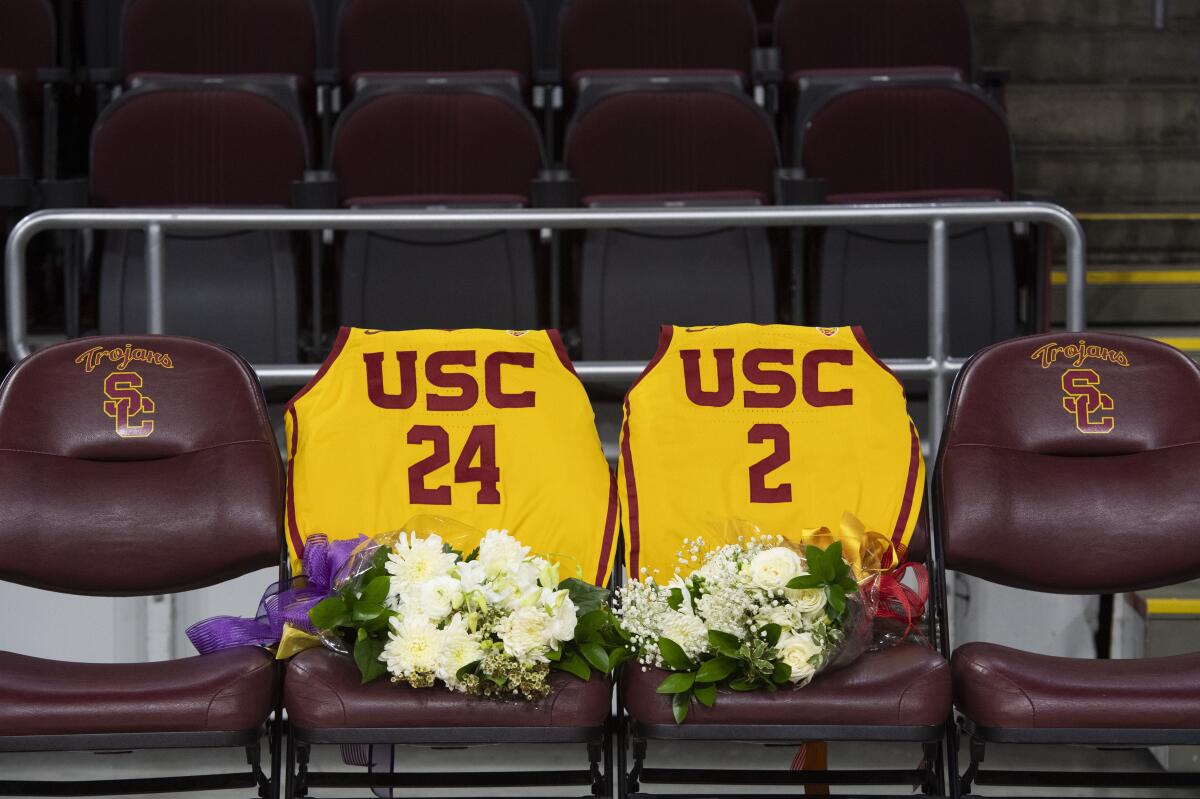 USC jerseys numbered for Kobe Bryant and his daughter Gianna displayed on the courtside seating before the game between USC and Utah on Thursday at Galen Center.