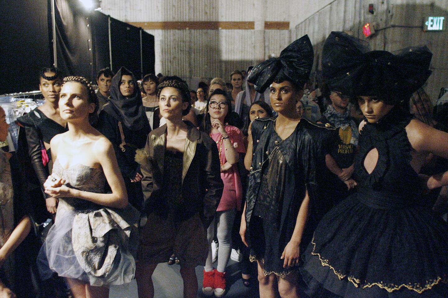 Models and fashion designers look up at the projector screen during Woodbury University's "Neo-tribes" runway event, which took place at Los Angeles Center Studios on Thursday, May 2, 2013.