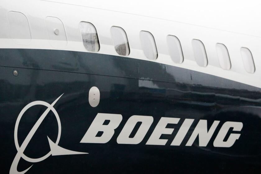 (FILES) In this file photo taken on March 07, 2017, the Boeing logo on the first Boeing 737 MAX 9 airplane is pictured during its rollout for media at the Boeing factory in Renton, Washington. - Boeing raised its full-year profit and revenue forecasts on Wednesday, October 24, 2018 following a better-than-expected third quarter as demand for commercial and defense aircraft stayed robust. (Photo by Jason Redmond / AFP)JASON REDMOND/AFP/Getty Images ** OUTS - ELSENT, FPG, CM - OUTS * NM, PH, VA if sourced by CT, LA or MoD **