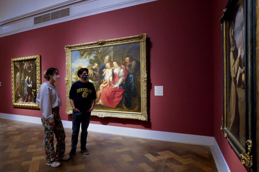 San Diego, CA - April 03: At the San Diego Museum of Art in Balboa Park on Saturday, April 3, 2021 in San Diego, CA., Annie Yean and Jack Read from Encinitas enjoyed viewing the paintings in one of the galleries. (Nelvin C. Cepeda / The San Diego Union-Tribune)