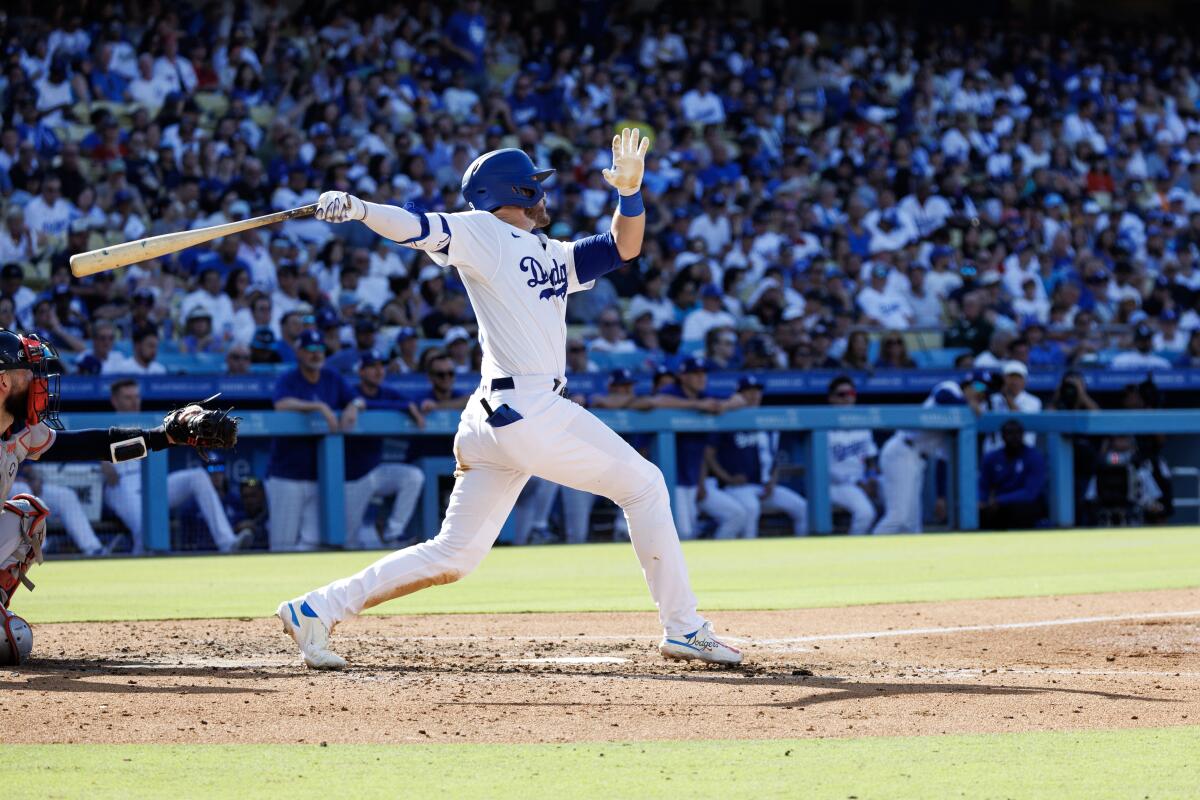 Gavin Lux hits a solo home run in the fourth inning of the Dodgers' win over the Red Sox on Sunday.