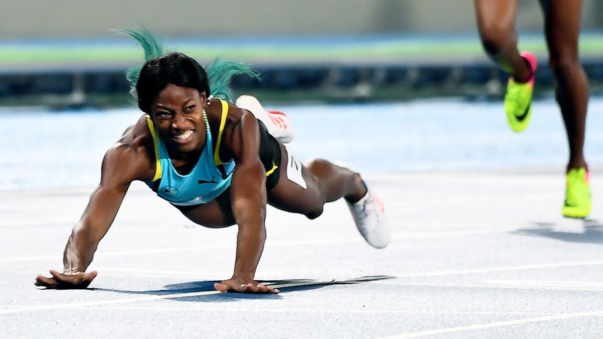 Shaunae Miller of the Bahamas dives for the finish line to win the gold medal in the 400 meters on Monday night.