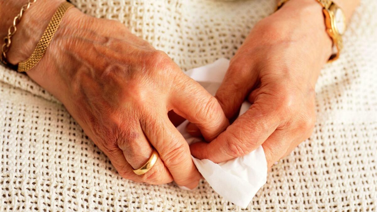 When the author's mother began to suffer from dementia, her worries did not subside with the rest of her personality. Pictured above, the hands of an elderly woman.