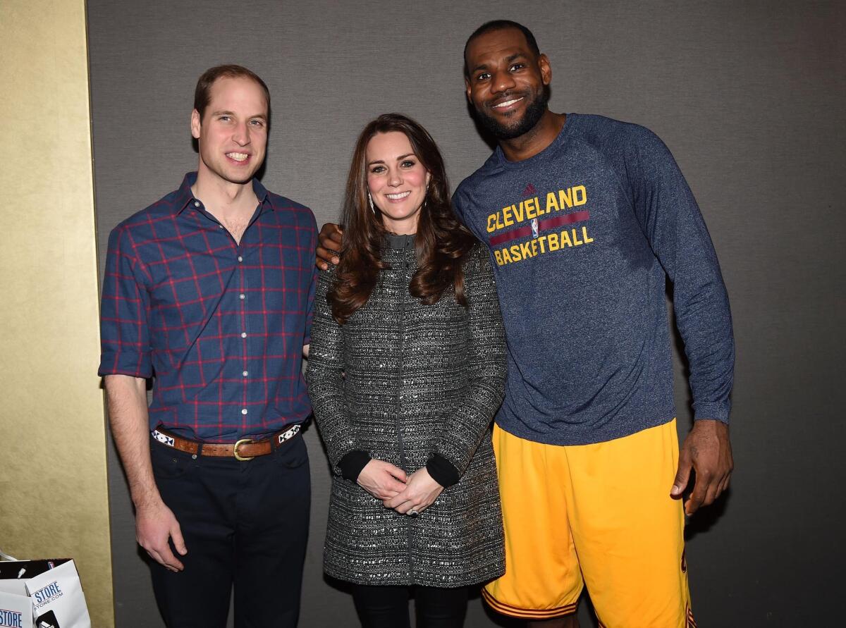 Prince William and his wife, Catherine, pose with NBA star LeBron James on Monday in New York City.