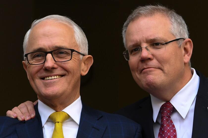 AUSTRALIA AND NEW ZEALAND OUT Mandatory Credit: Photo by LUKAS COCH/EPA-EFE/REX/Shutterstock (9804990a) Then Australian Prime Minister Malcolm Turnbull and Australian Federal Treasurer Scott Morrison speak to the media during a press conference at Parliament House in Canberra, Australian Capital Territory, Australia, 22 August 2018 (issued 24 August 2018). Scott Morrison is Australia's new prime minister after winning a liberal party vote for leadership. Australia's New Prime Minister Scott Morrison, Canberra - 22 Aug 2018 ** Usable by LA, CT and MoD ONLY **