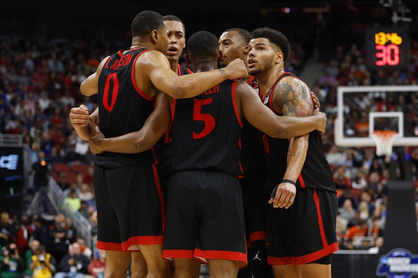 Louisville, KY - March 24: San Diego State gathers on the court during a win against Alabama.