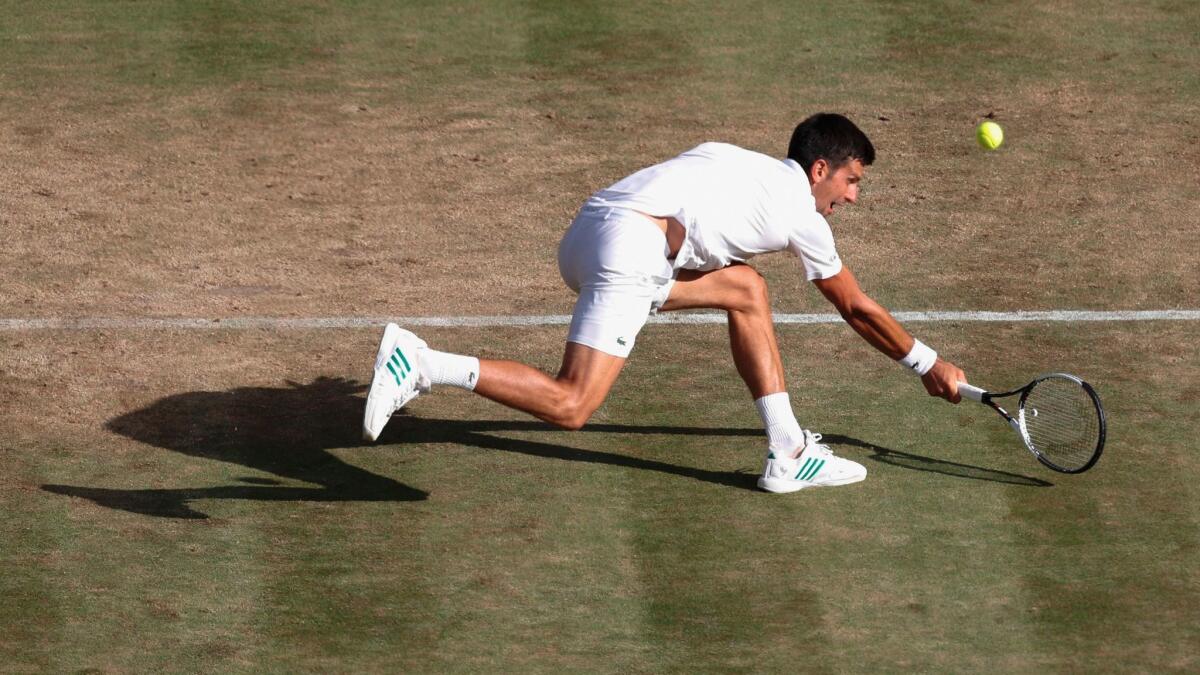 Serbia's Novak Djokovic returns against Latvia's Ernests Gulbis during their third round Wimbledon match on Saturday.