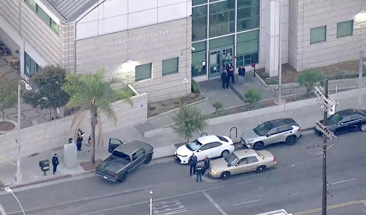 An aerial view of cars outside the Newton police station