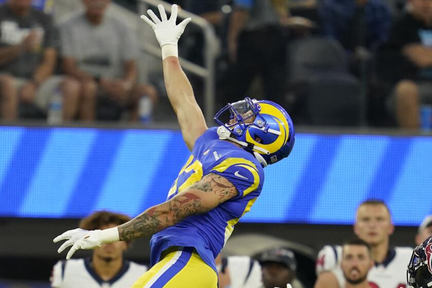 Los Angeles Rams tight end Jacob Harris (87) leaps but cannot make a catch on a high pass.
