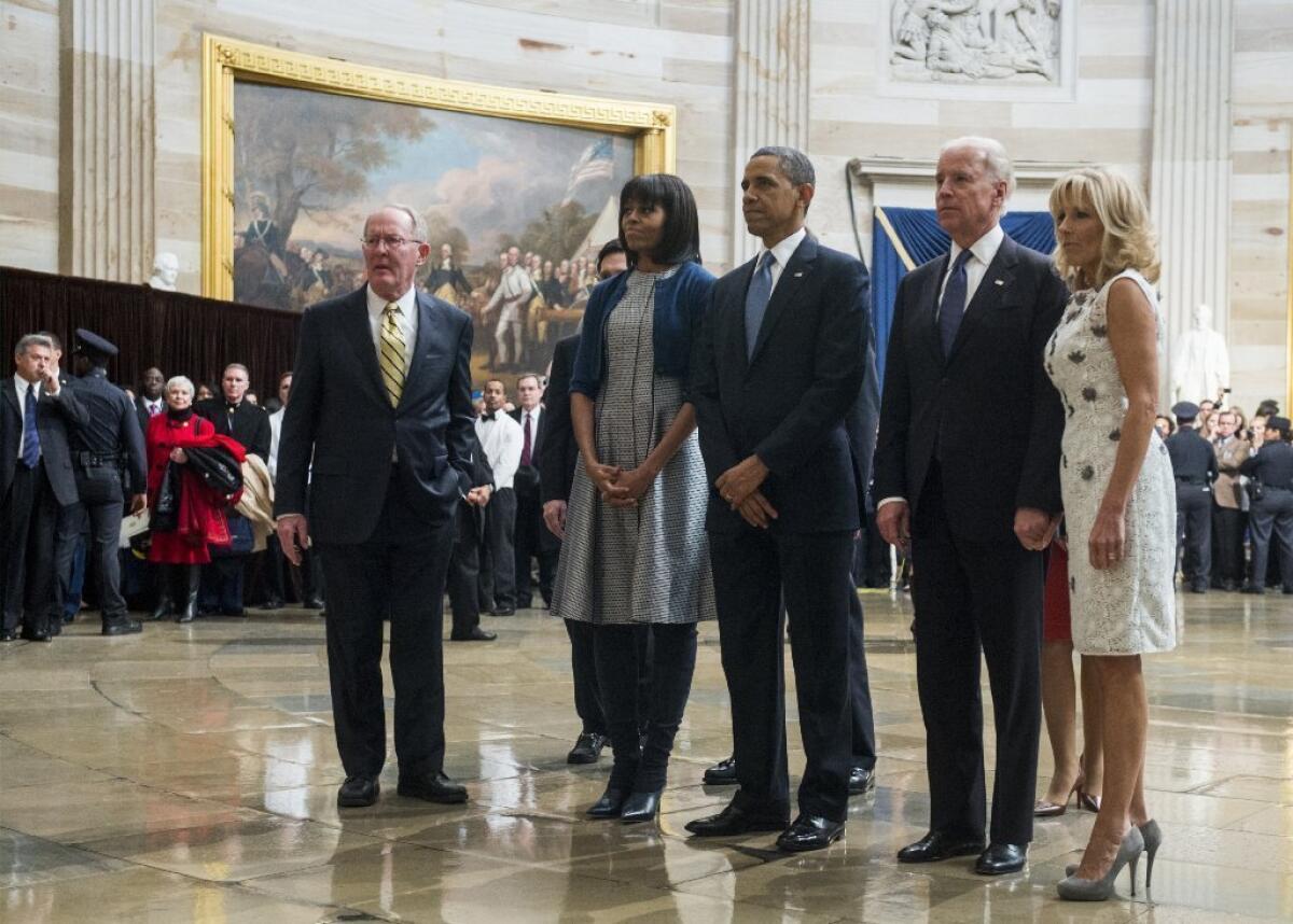 Sen. Lamar Alexander and Rep. Eric Cantor join the Obamas and Bidens in paying their respects at a Martin Luther King Jr. statue in the Capitol rotunda.