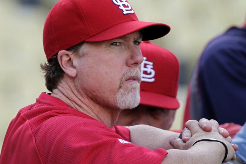 Dodgers batting coach Mark McGwire, shown with the St. Louis Cardinals in 2011, was named on just 16.9% of Hall of Fame ballots this year, far short of the 75% necessary for election.