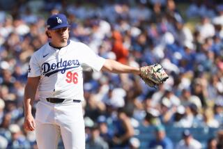 LOS ANGELES, CALIFORNIA - OCTOBER 14: Landon Knack #96 of the Los Angeles Dodgers reacts.