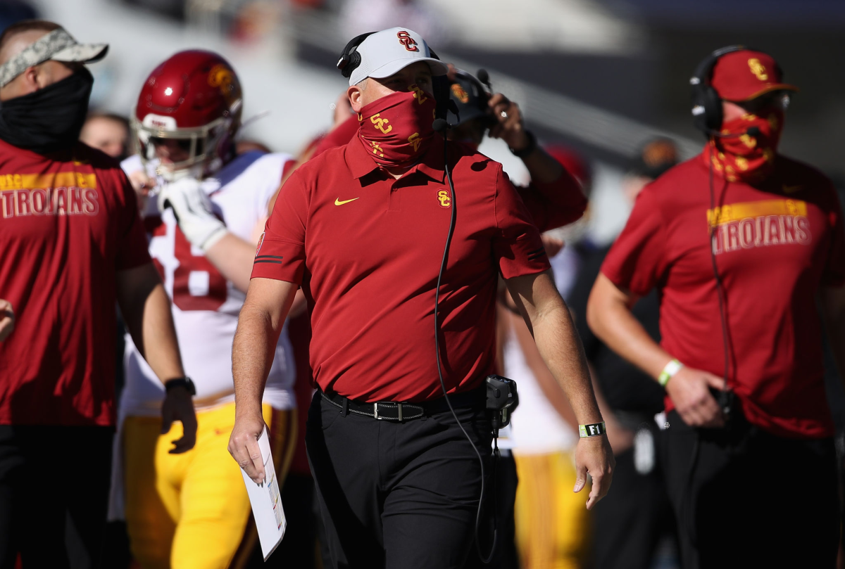 USC coach Clay Helton watches on the sideline during a game against Arizona.
