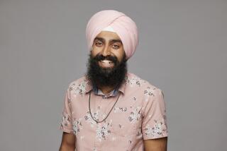 Jag Bains smiles while wearing a pink flowered button-up shirt and a matching pink Sikh turban