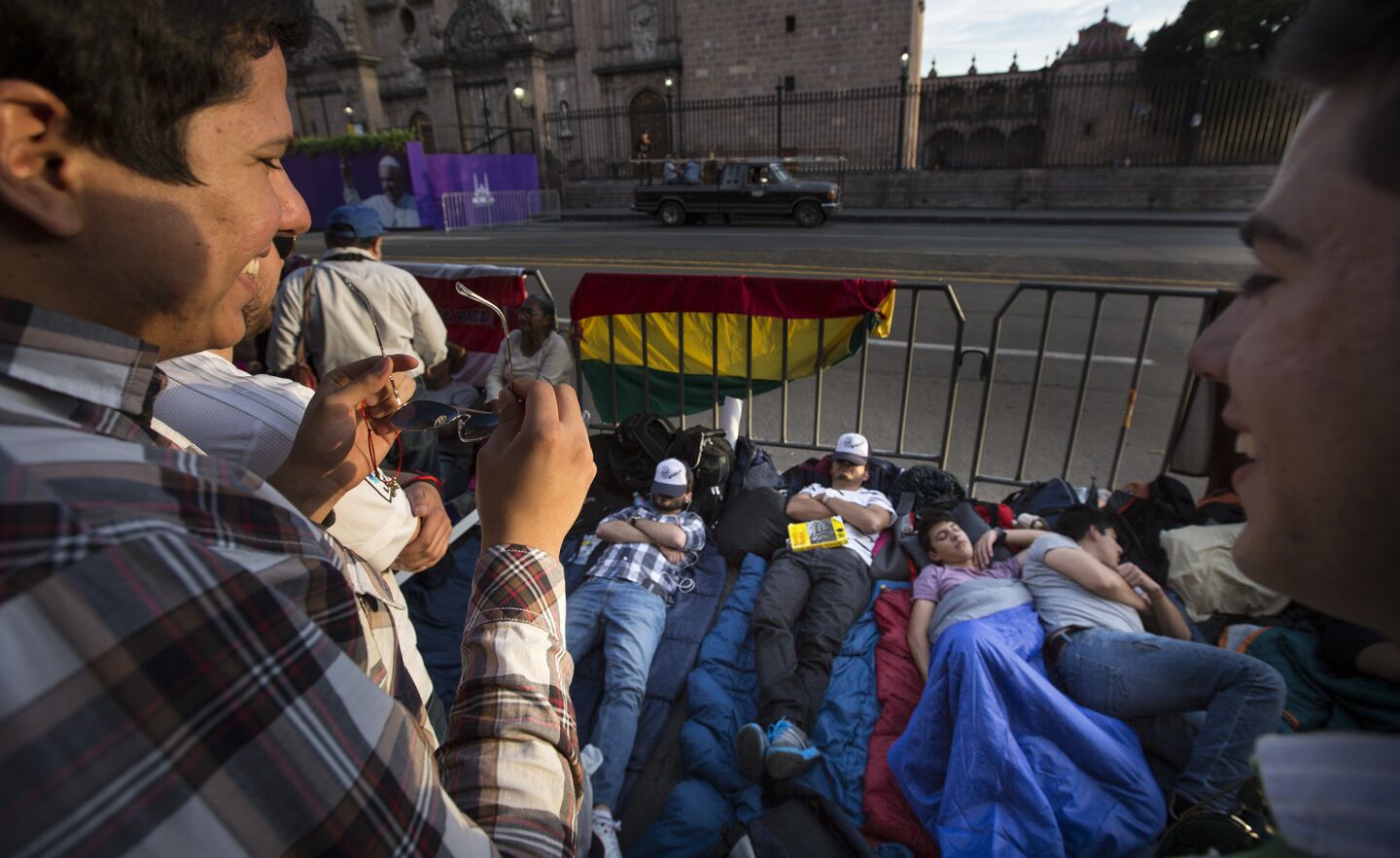 Young men are camped out across the street from the Morelia Cathedral as preparations continue for Pope Francis' arrival in Morelia, Michoacan.