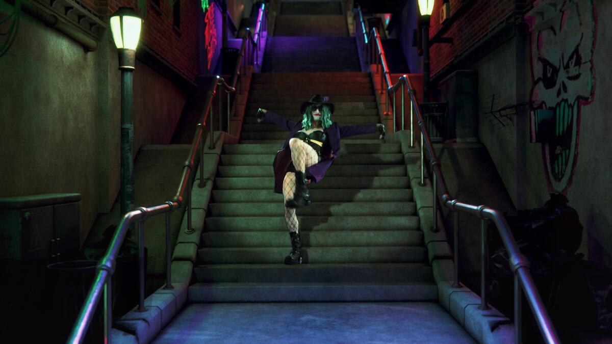 A person in a clown outfit descends a stairwell.
