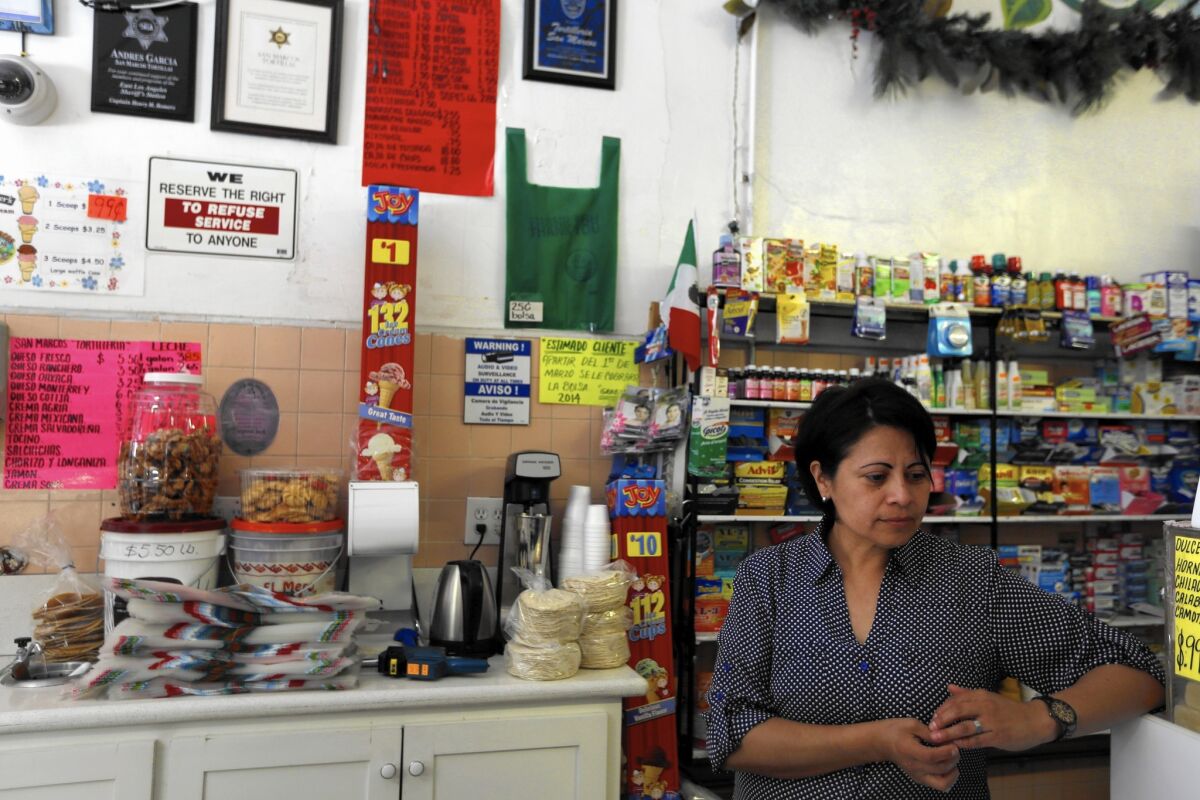 Sandra Carrera, 38, who works the register at Tortilleria San Marcos in Boyle Heights, says a wage increase can't come soon enough.