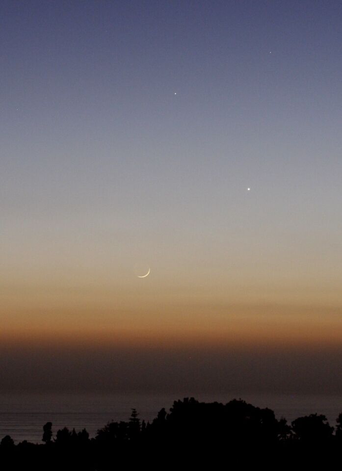 The planet Mercury (top), the planet Venus (middle) and the moon (bottom) are captured May 23 from Mount Soledad.