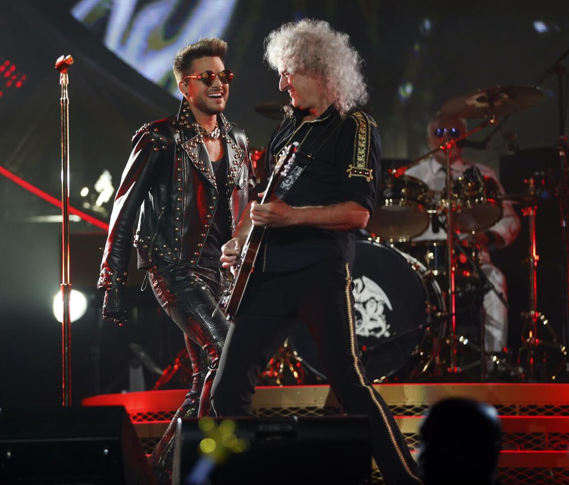 Queen's Brian May and Adam Lambert perform at the United Center.