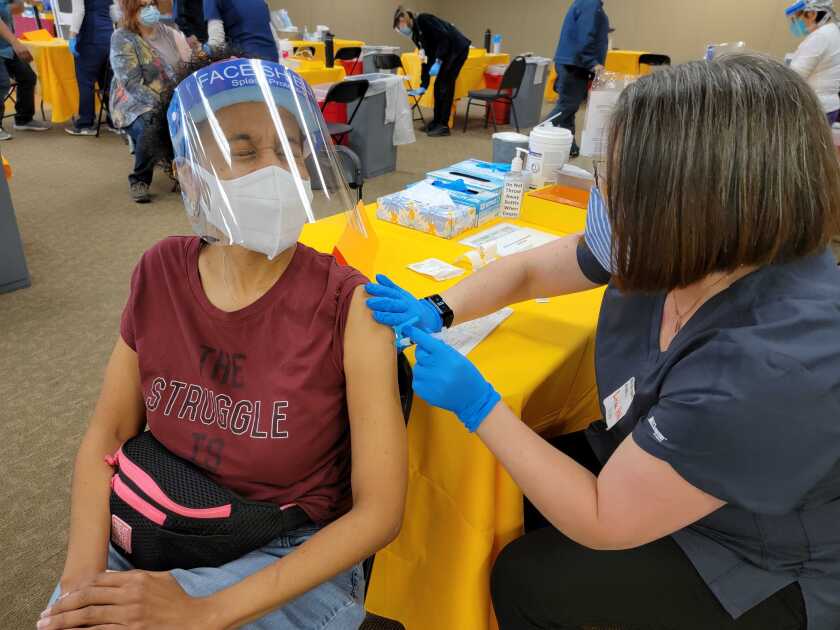 Elementary school teacher Tinika Hagler, 46, of Spring Valley, gets vaccinated for COVID-19 on Saturday