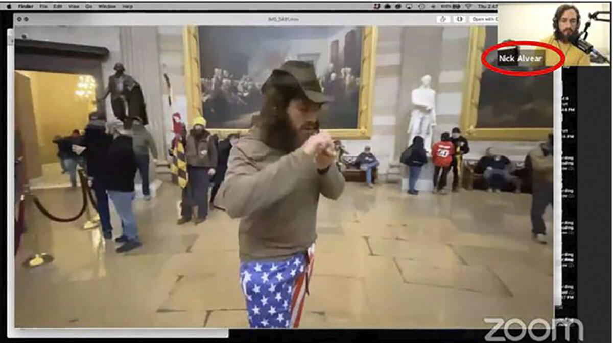 A  video image shows a man smoking in the Capitol Rotunda 