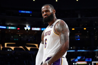 LOS ANGELES, CA - DECEMBER 12: LeBron James #6 of the Los Angeles Lakers reacts after scoring a basket.