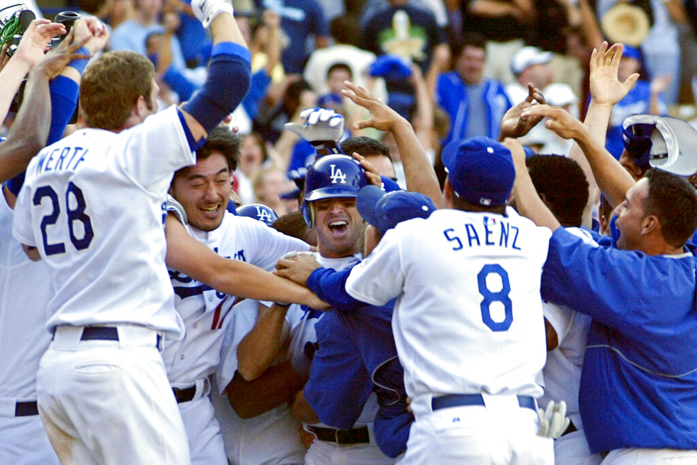 Dodgers' Steve Finley celebrates with teammates after hitting a grand slam.
