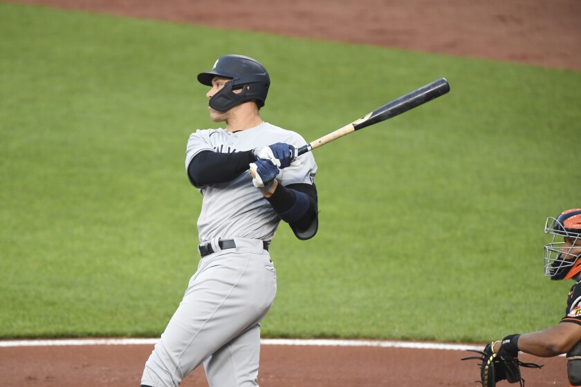New York Yankees' Aaron Judge watches his first-inning home run hit off Baltimore Orioles starting pitcher Dean Kremer during a baseball game on Friday, May 14, 2021, in Baltimore. (AP Photo/Terrance Williams)