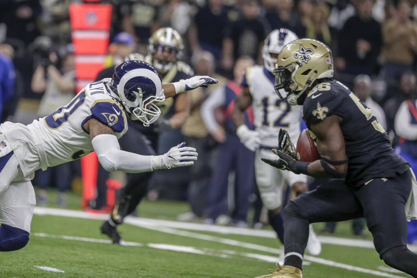 Saints linebacker Demario Davis intercepts a pass intended for Rams running back Todd Gurley early in the first quarter in the NFC Championship on Jan. 20.