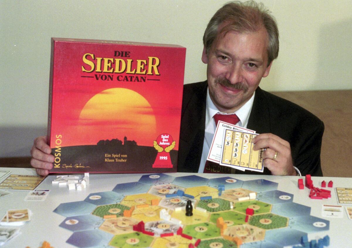 A man next to a board game