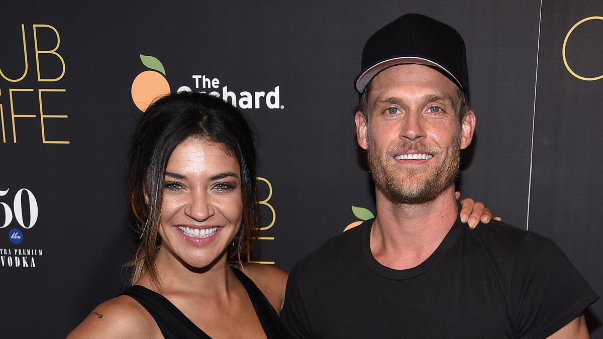 Actress Jessica Szohr, left, and Ethan Russell attend the New York premeire of "Club Life."