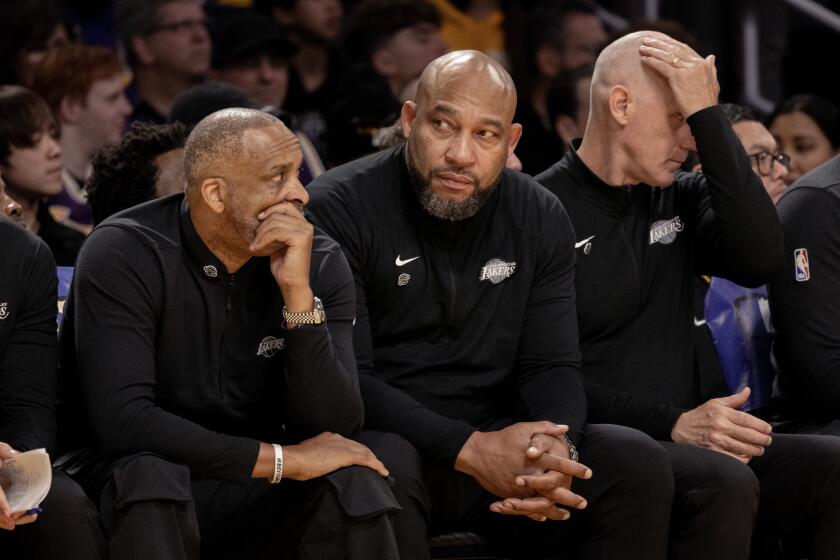 LOS ANGELES, CA - APRIL 7, 2024: Lakers head coach Darvin Ham, middle, sits on the bench in the closing moments of the Lakers 127-117 loss to the Minnesota Timberwolves at Crypto.com Arena on April 7, 2024 in Los Angeles, California.(Gina Ferazzi / Los Angeles Times)