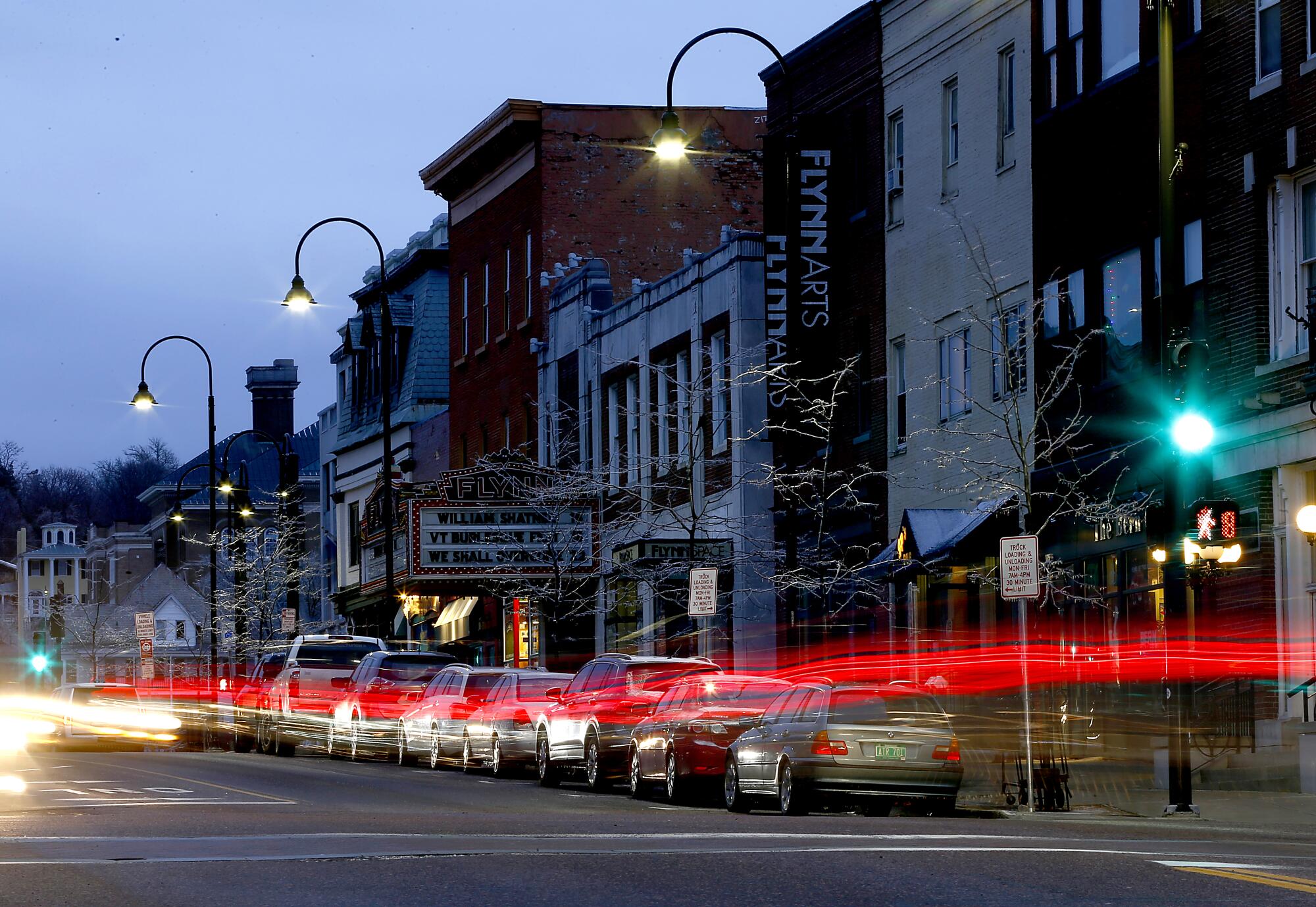 Evening traffic streams past the historic buildings of downtown Burlington, Vt. Located on the eastern shore of Lake Champlain, Burlington was built on a strip of land extending about 6 miles south from the mouth of the Winooski River, and initially served as a port for the area's now defunct logging industry.