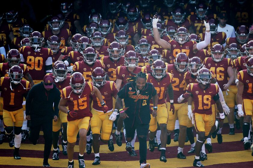 The USC Trojans take the field for a game against Arizona at the Coliseum on Oct. 30