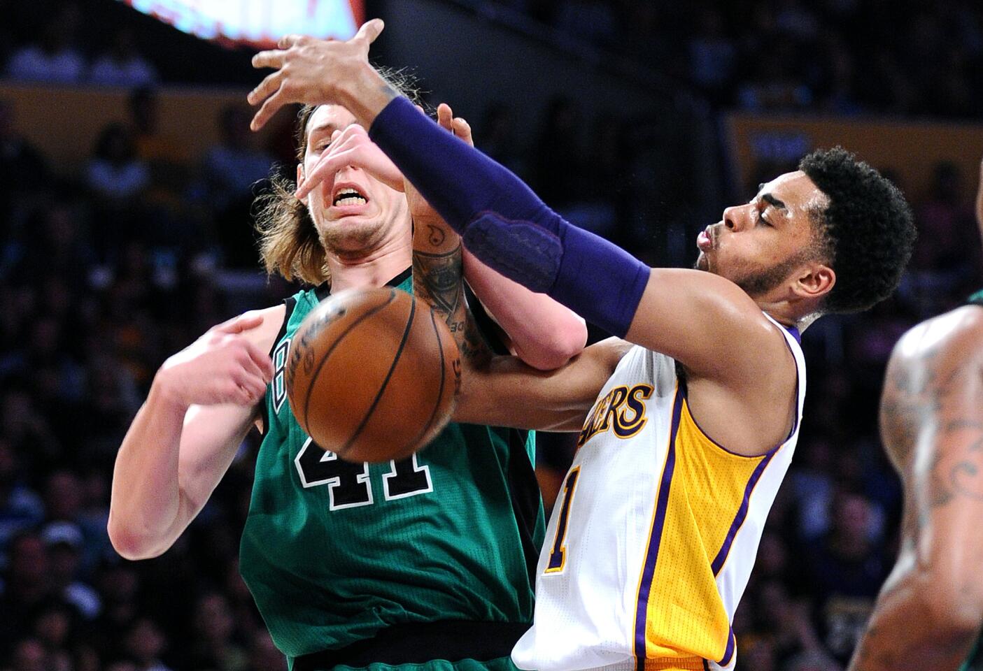 Lakers guard D'Angelo Russell, knocking the ball away from Celtics forward Kelly Olynyk during a game last season, knows that a good offense often starts with good defense.